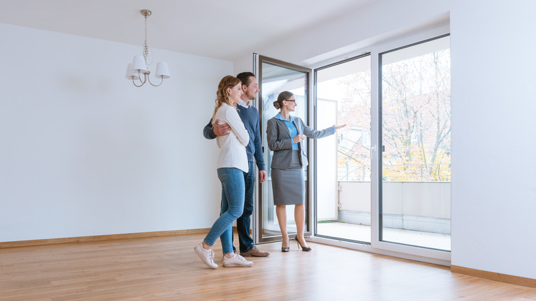 Couple being shown apartment/house by realtor