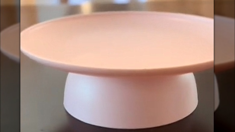 Plastic plate glued to bowl to make larger riser