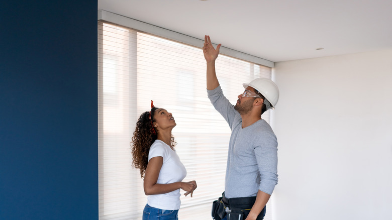 designer and client discussing ceiling