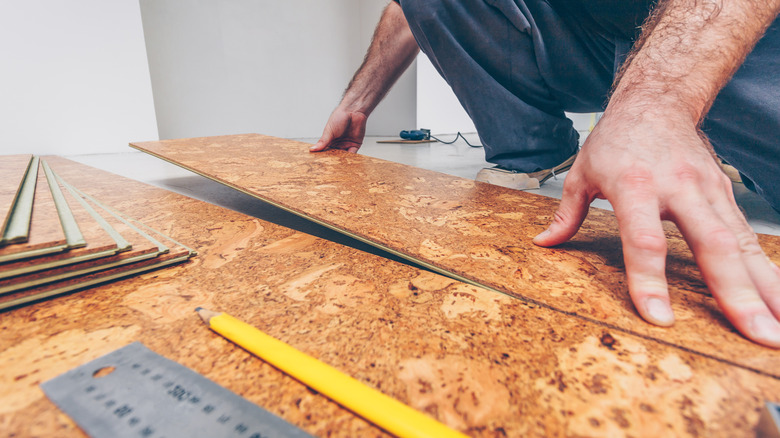 Man installing cork floor