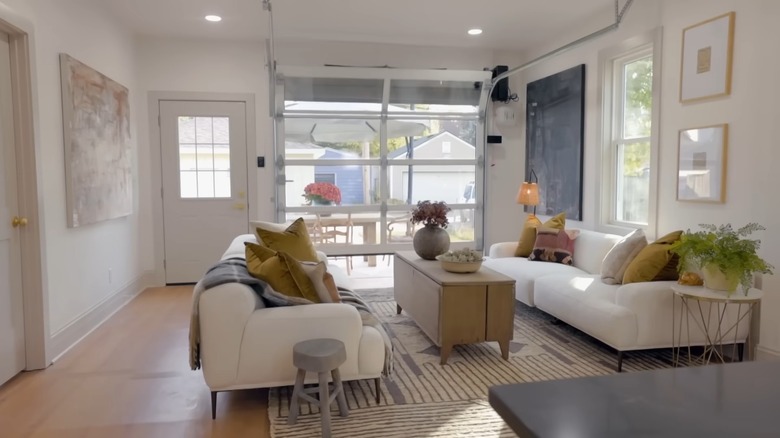 White living room with glass garage door