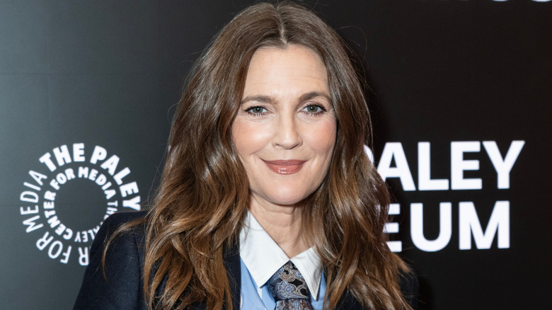 Drew Barrymore smiling at a red carpet event