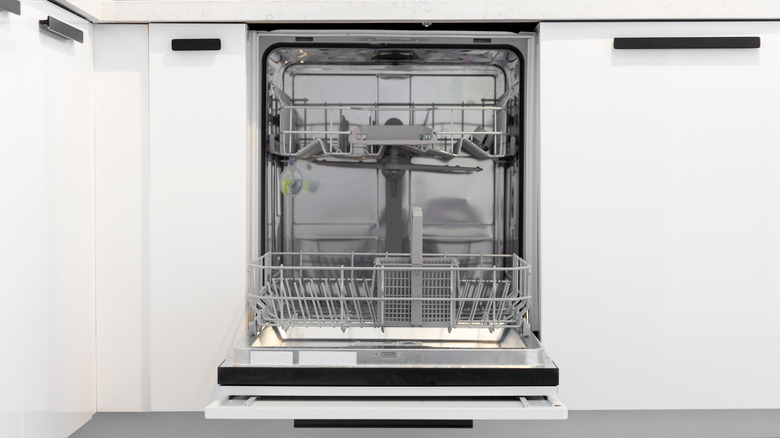 empty dishwasher in white kitchen