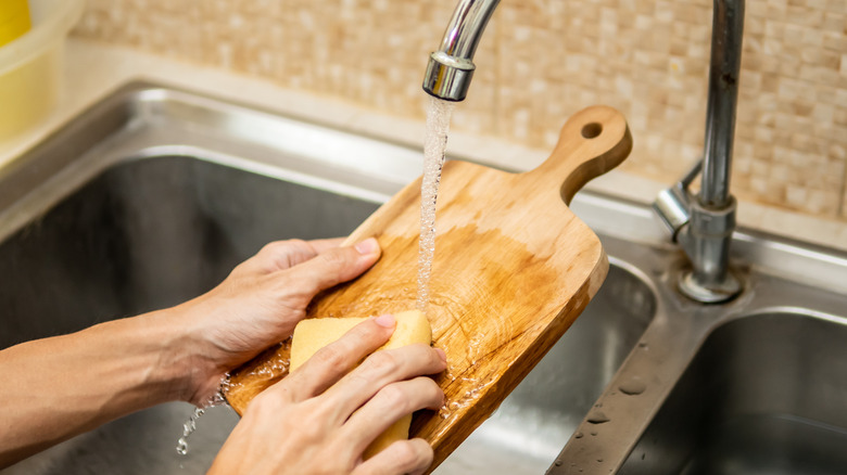 hand washing at kitchen sink