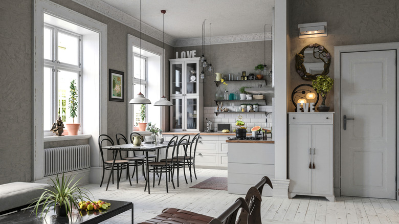 A mostly white modern farmhouse kitchen in an open-plan home design.