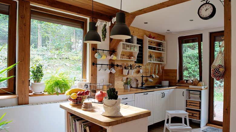 A rustic kitchen with wood and open shelving.