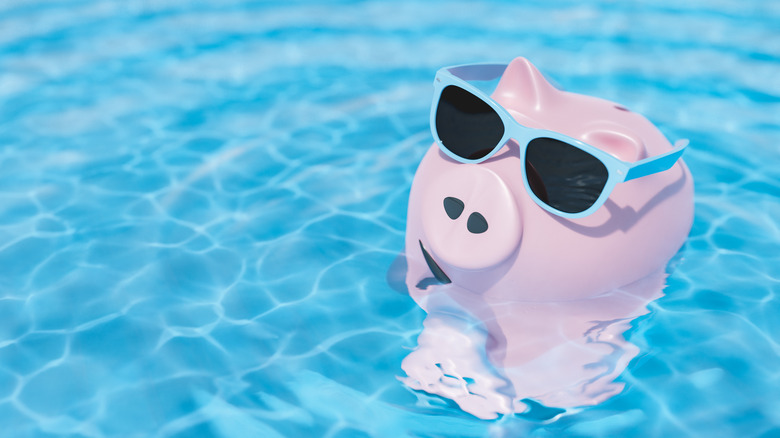 piggy bank floating in a pool