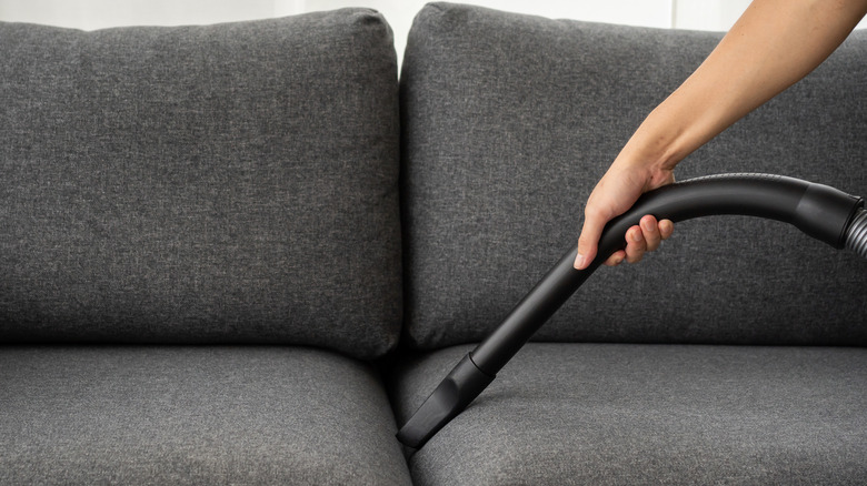 vacuuming between couch cushions