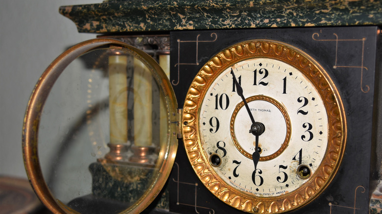 A Seth Thomas clock on a shelf