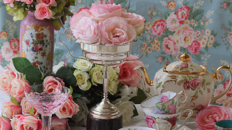 Vintage silver trophy used as display on tablescape to hold flowers