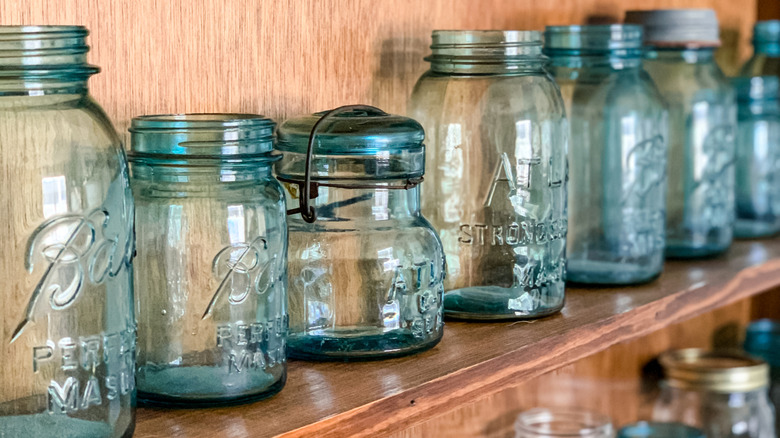 Row of vintage mason jars on a shelf