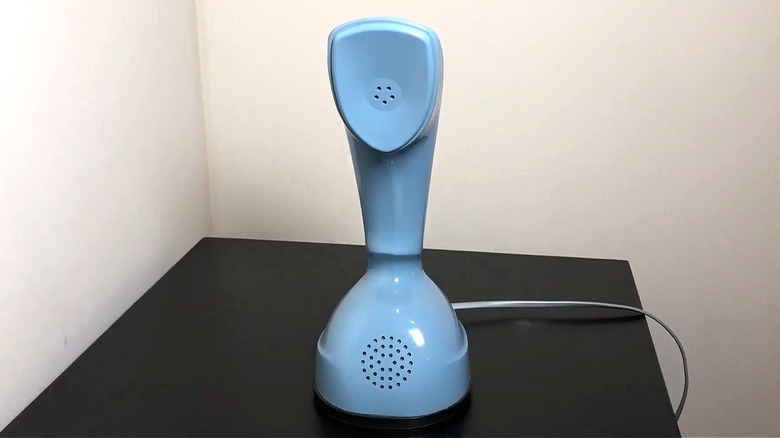 Vintage blue Ericofon Rotary Telephone, also known as Cobra Phone, by Sweden' LM Ericsson.