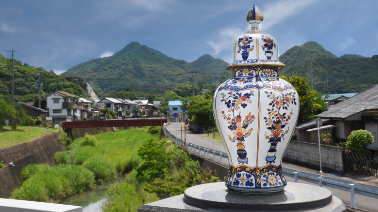 A beautiful Imari Ware vase with the town of Arita in the background.