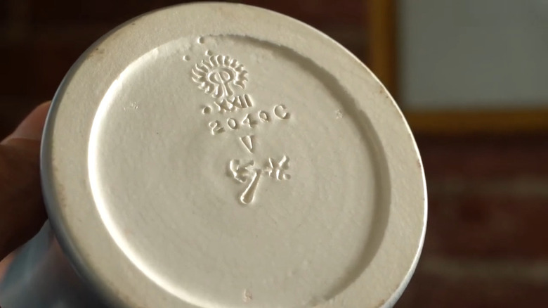 Closeup of the flame and signature mark of a Rookwood Pottery Company piece