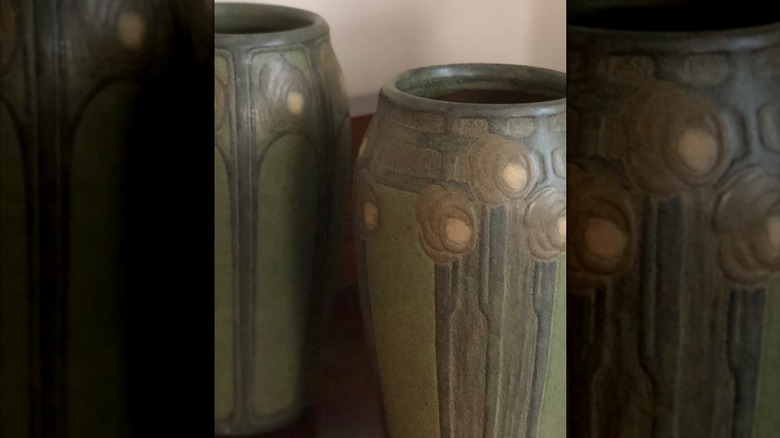 Two beautiful green Marblehead pottery vases with flower designs