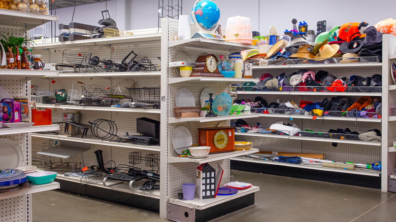 Interior of a thrift store with shelves full of items.