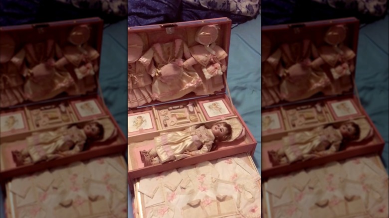 A vintage bisque doll in a box