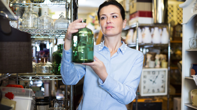 Someone shopping for glass jars