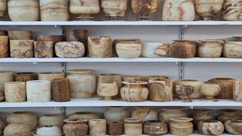 Rows of vintage alabaster vases.
