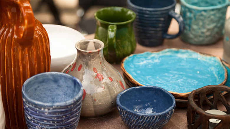 Various pottery pieces on sale, from vases to cups and plates