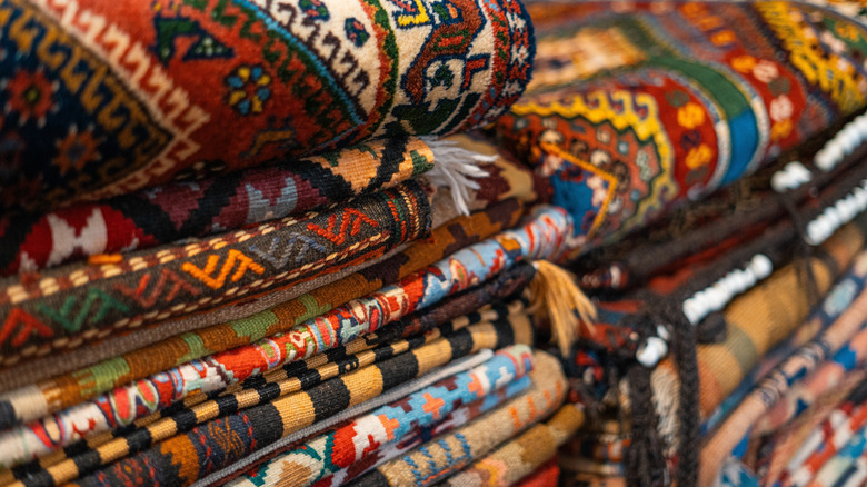 Stacks of rugs with unique patterns