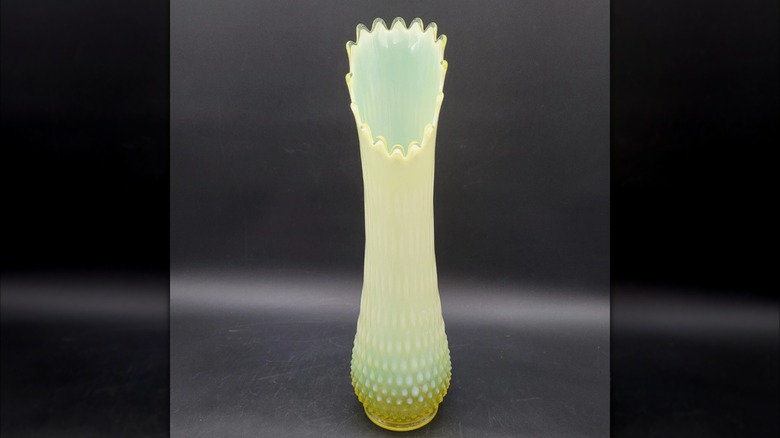 A vintage 1940s Fenton Opalescent swung vase