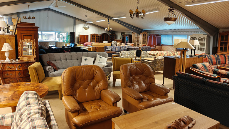 A thrift store full of antique furniture.