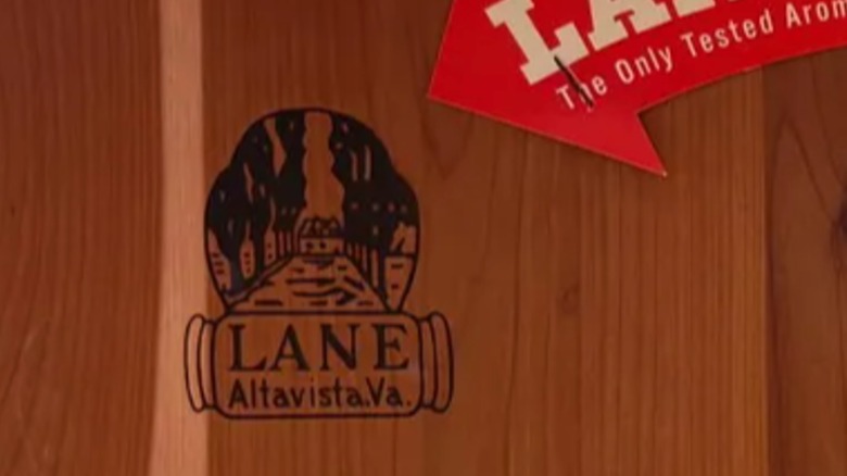 An up-close view of the Lane maker's mark on a wooden furniture piece.
