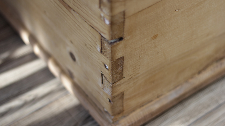 a wooden trunk with dovetail joint joinery technique