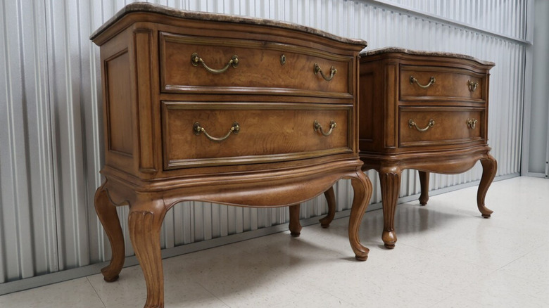 Photo of two wooden chests of drawers with metal pulls