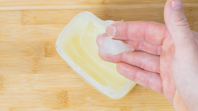 Vaseline on person's fingers