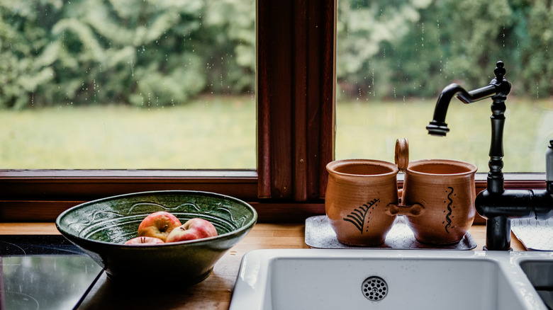 Kitchen countertop with earthy color palette and painted ceramics