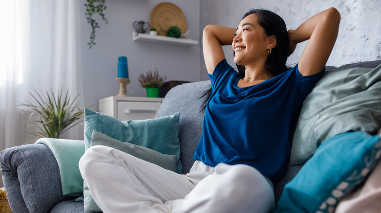 Woman sitting amidst blue motif