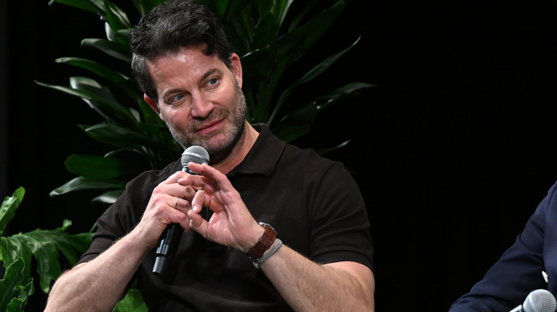Nate Berkus holding a mic during interview