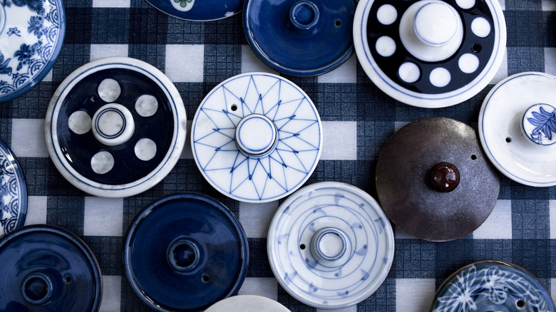 A collection of patterned ceramic lids with holes