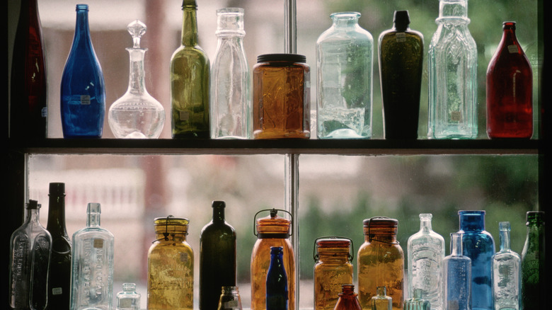 Colorful glassware on store shelf