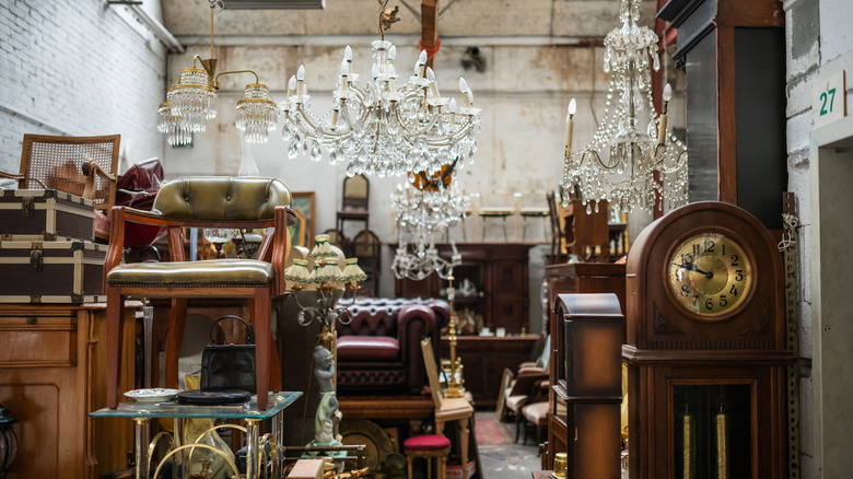 Vintage furnishings, lighting, and clocks in an antique shop.