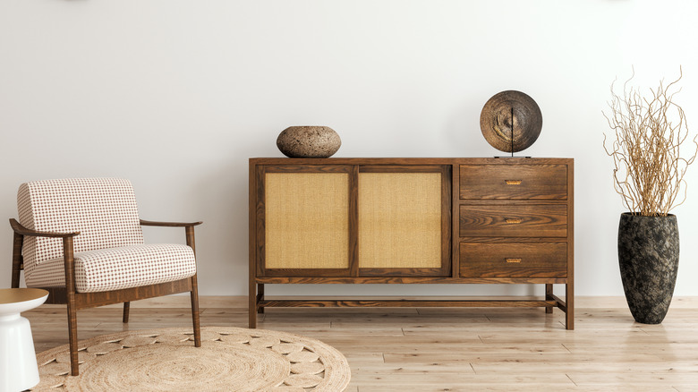 Stained vintage cabinet in a sleek, modern room
