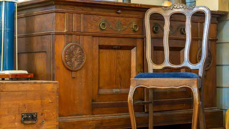 Vintage wooden chair, cabinet, and trunk