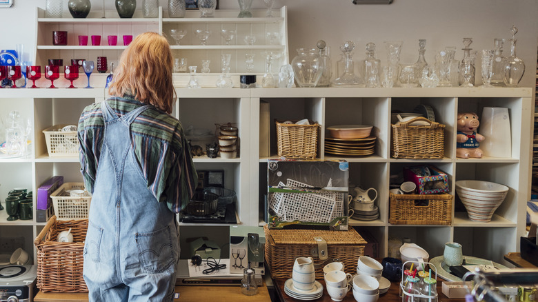 Person browsing thrift store items