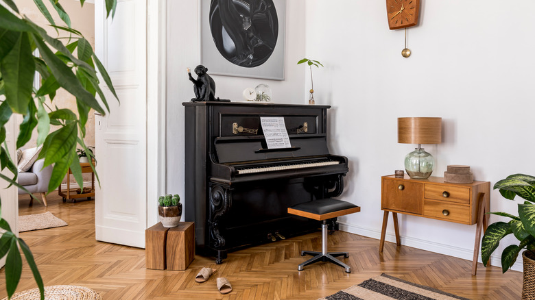 Black piano in neutral room