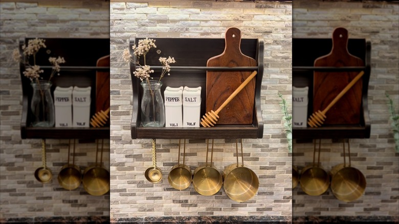 Mail organizer being used as measuring cup organizer and display shelf