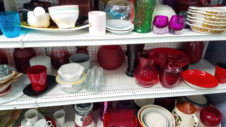 Thrift store shelves filled with kitchen items