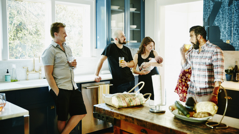 A group gathered in a large kitchen