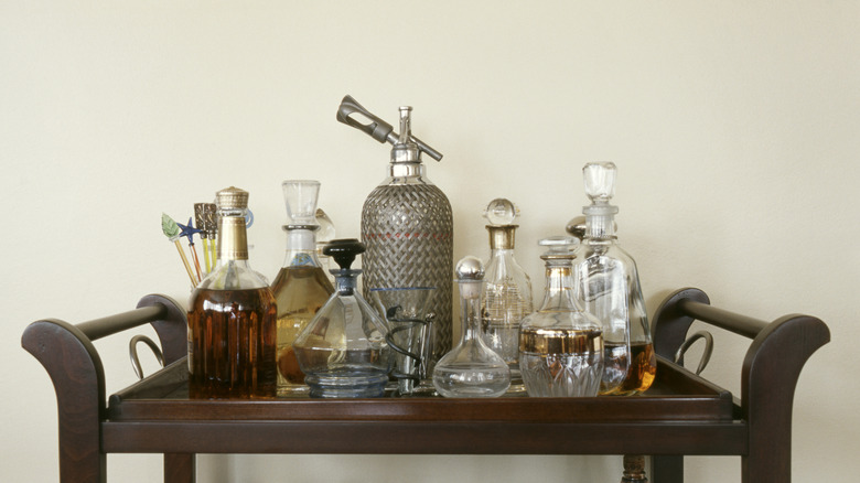 top of home bar cart with bottles and accessories
