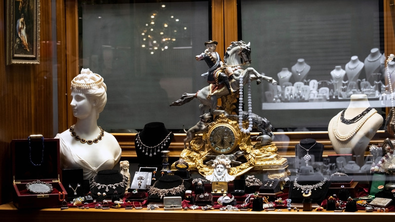 Various items at a thrift store displayed on a table