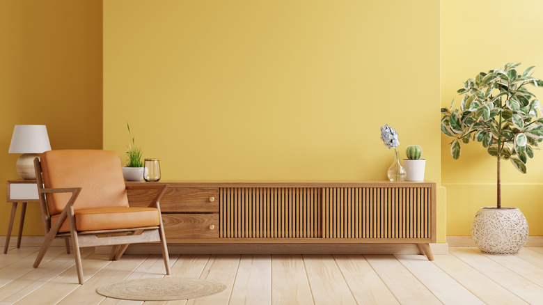 Yellow painted walls in mid-century modern room