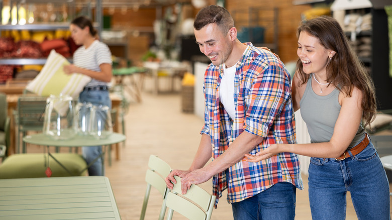 A couple shopping for patio furniture