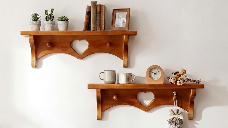 Two vintage inspired shelves with heart cut outs.