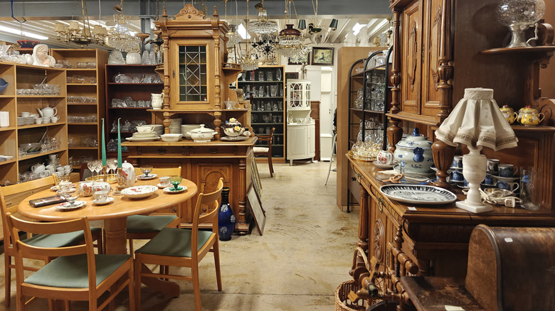 An antique store full of vintage wood furniture.
